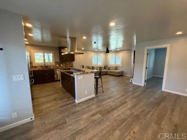 a kitchen with stainless steel appliances granite countertop a stove and a sink