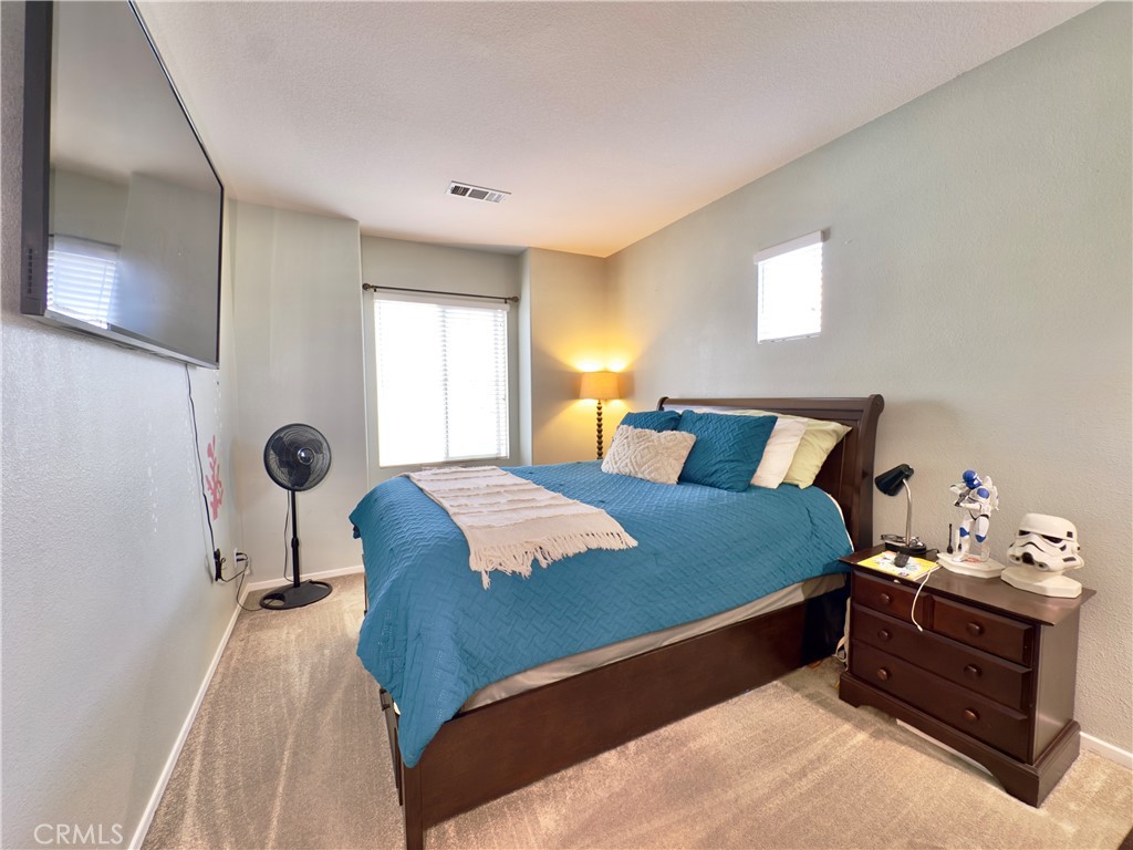 11265 Runyan Road Beaumont, CA 92223 - Photo 71 of 138 a bedroom with a bed and window