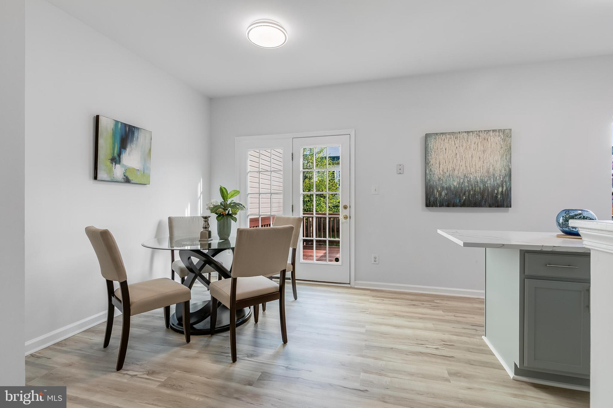 46716 Cavendish Square Sterling, VA 20165 - Photo 13 of 42 a view of a dining room with furniture and wooden floor