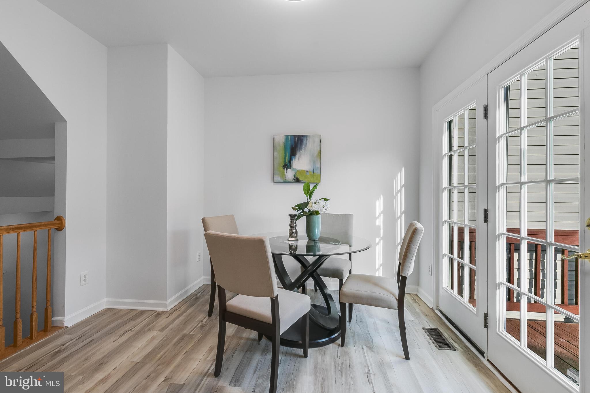 46716 Cavendish Square Sterling, VA 20165 - Photo 14 of 42 a view of a dining room with furniture and wooden floor