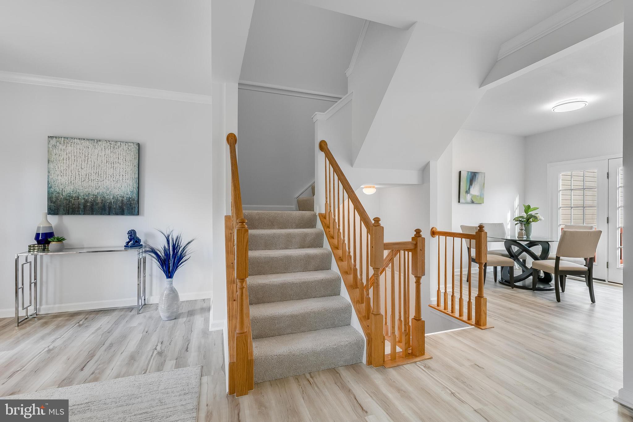 46716 Cavendish Square Sterling, VA 20165 - Photo 16 of 42 a view of entryway and hall with wooden floor