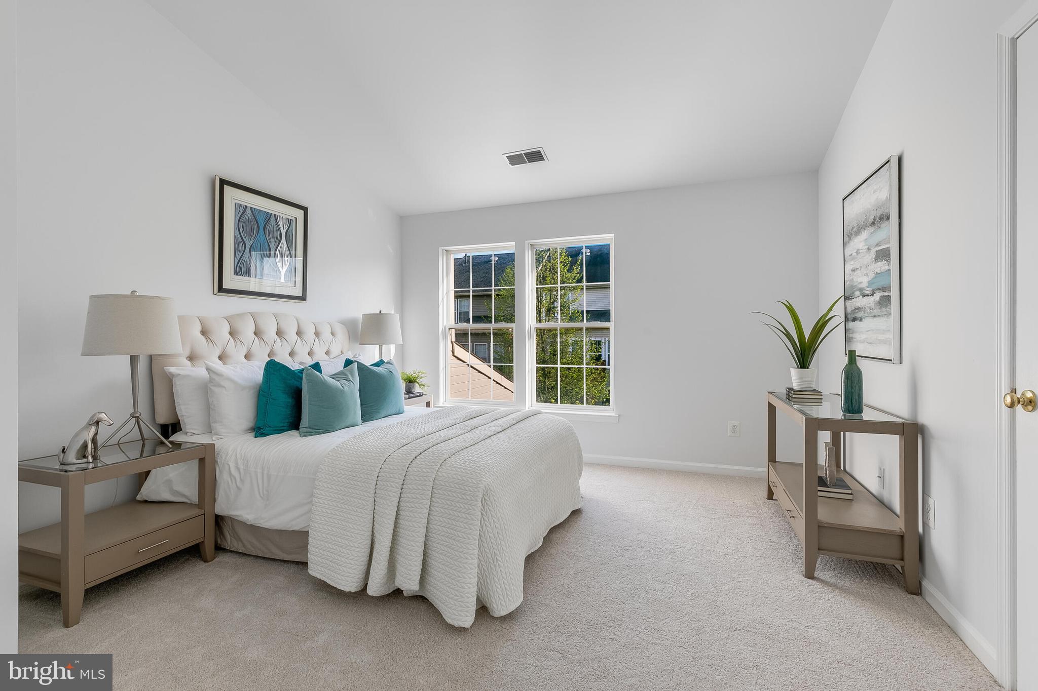 46716 Cavendish Square Sterling, VA 20165 - Photo 17 of 42 a bedroom with a bed and a table