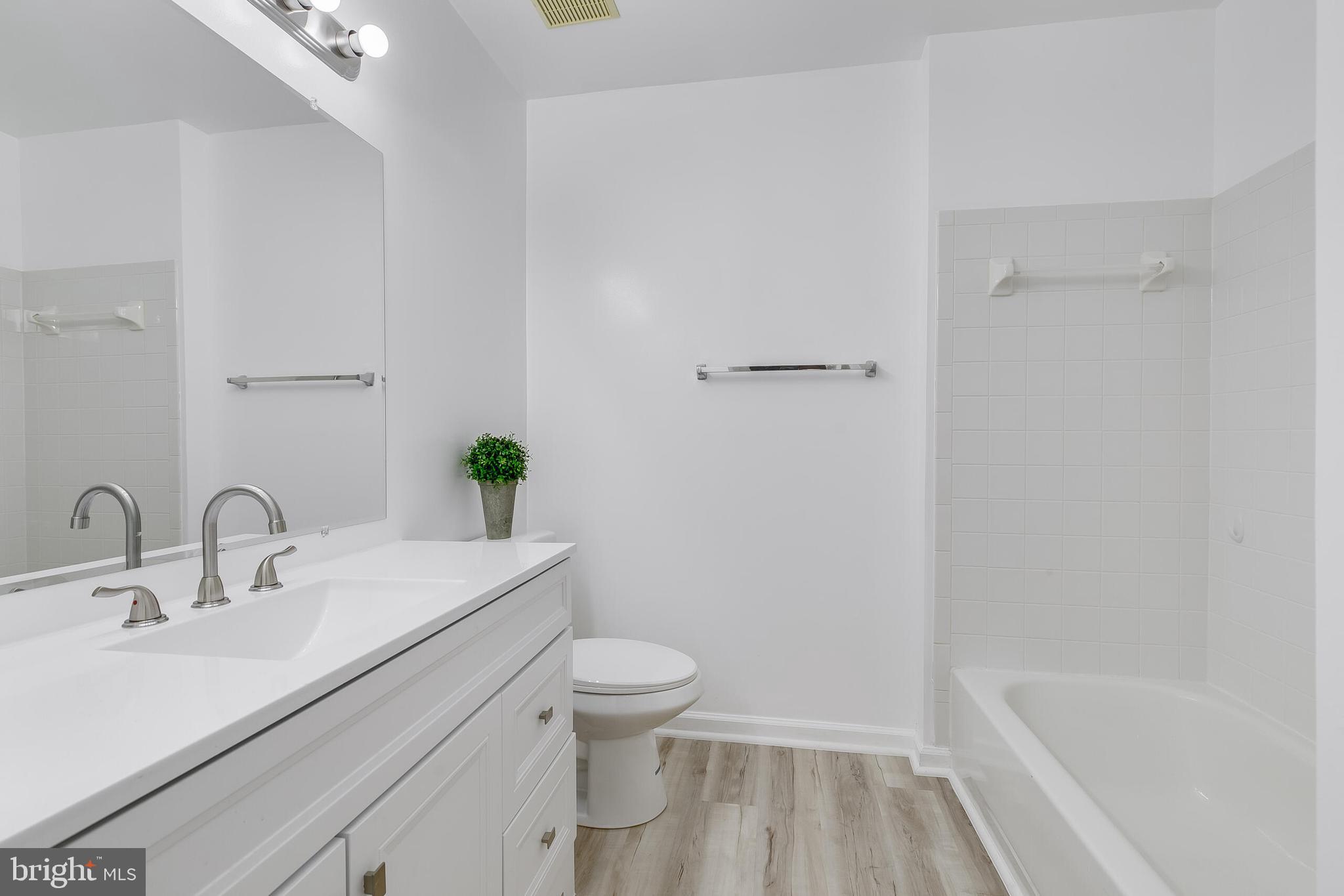 46716 Cavendish Square Sterling, VA 20165 - Photo 28 of 42 a bathroom with a sink a toilet and shower