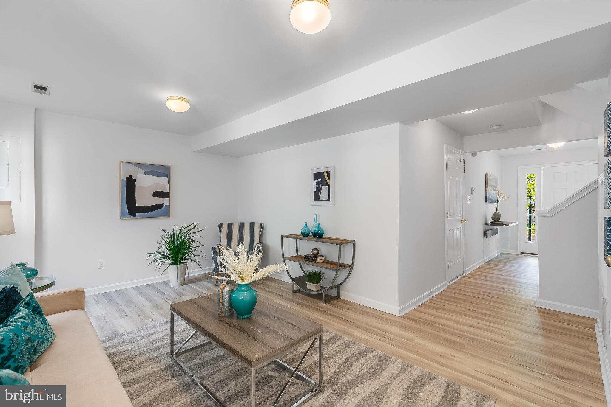 46716 Cavendish Square Sterling, VA 20165 - Photo 32 of 42 a living room with furniture and a wooden floor