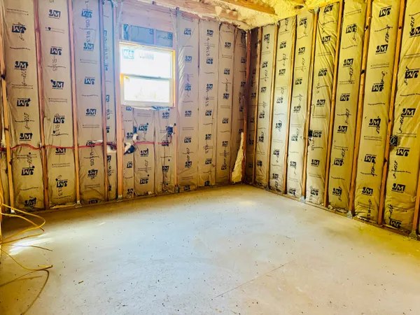 a view of a room with large windows
