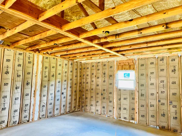 a view of an empty room with wooden walls