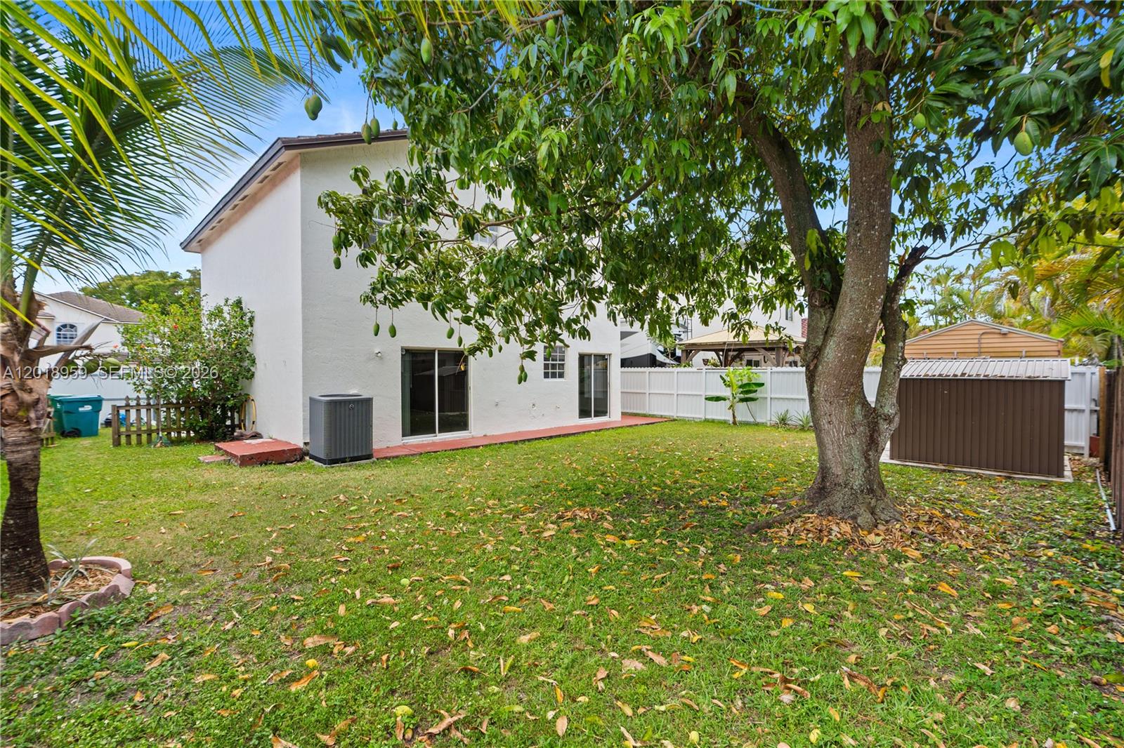 15345 Southwest 63rd Terrace Miami, FL 33193 - Photo 51 of 51 a view of a house with backyard and a tree