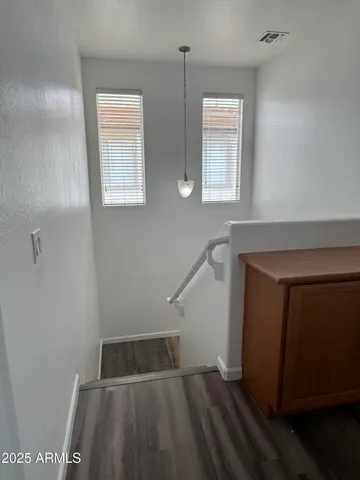 a view of entryway with wooden floor