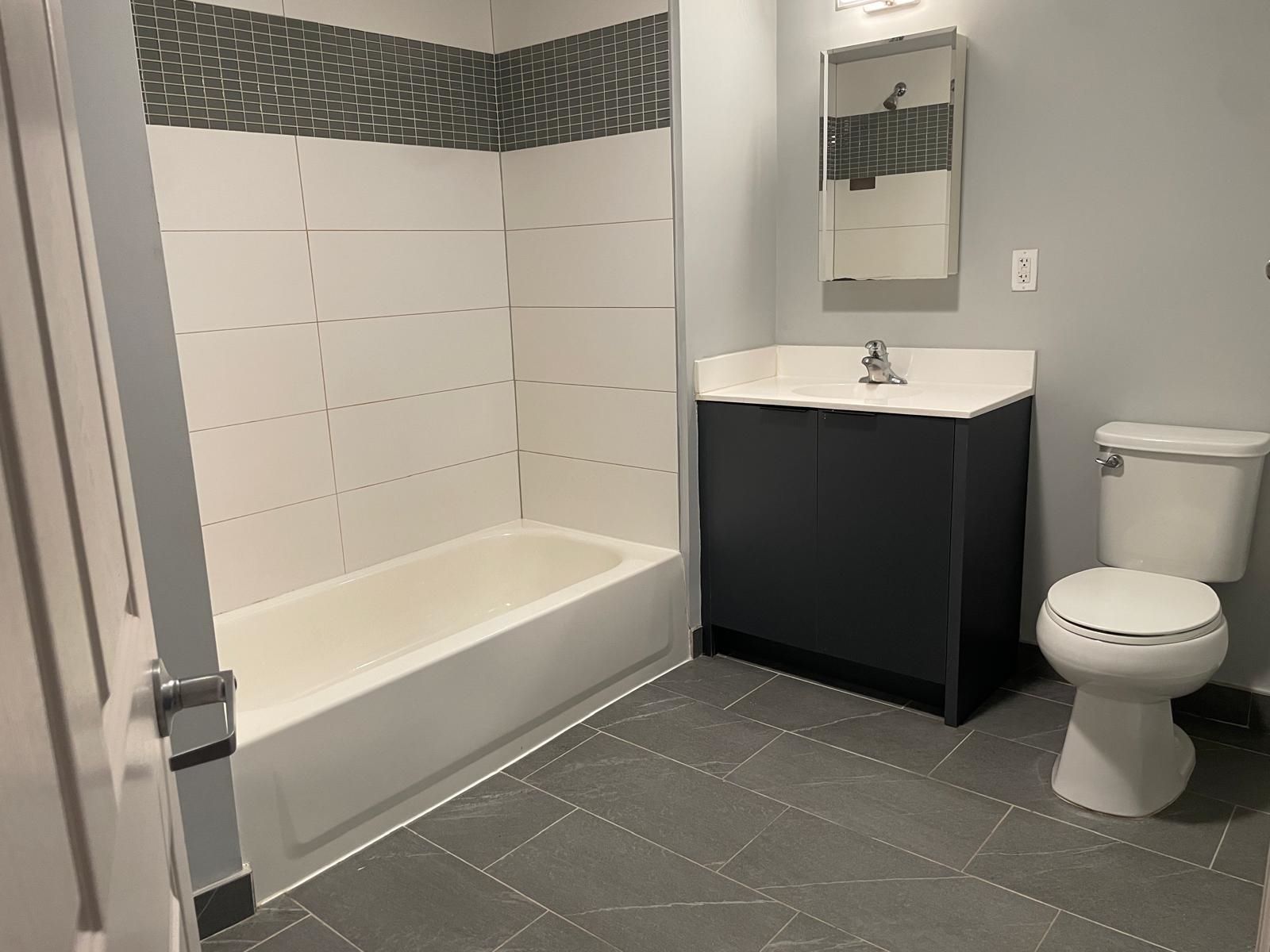 160 Lafayette Street, Unit 52207 Jersey City, NJ 07304 - Photo 17 of 25 a bathroom with a sink toilet and shower