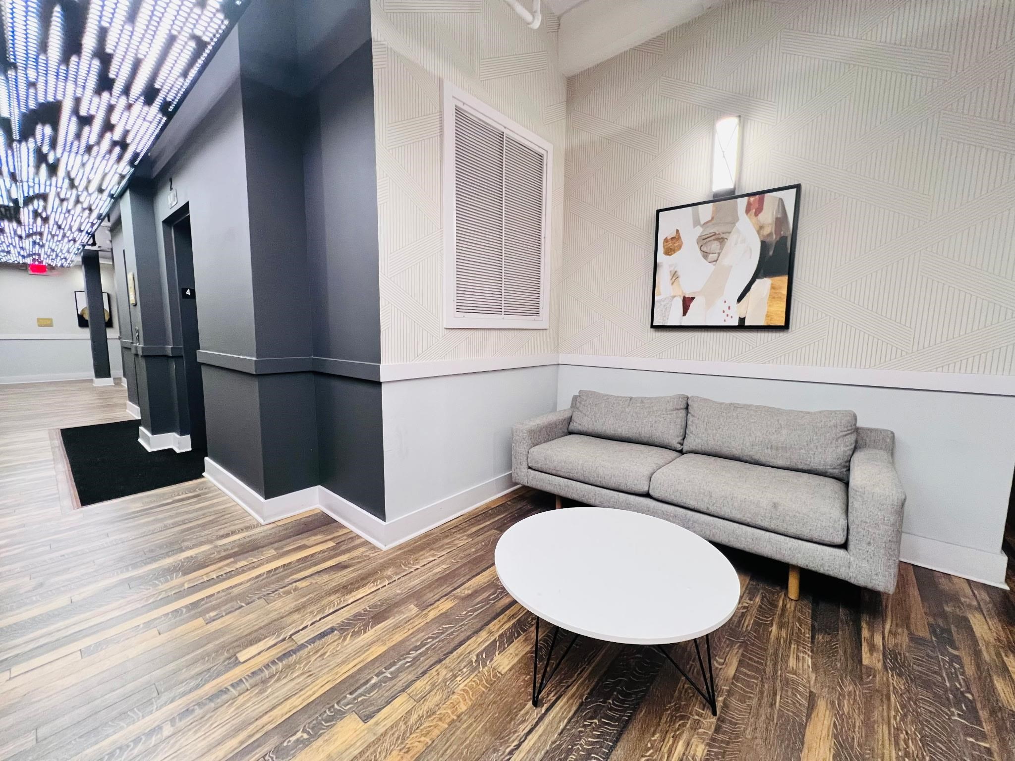 160 Lafayette Street, Unit 52207 Jersey City, NJ 07304 - Photo 19 of 25 a living room with furniture and a wooden floor