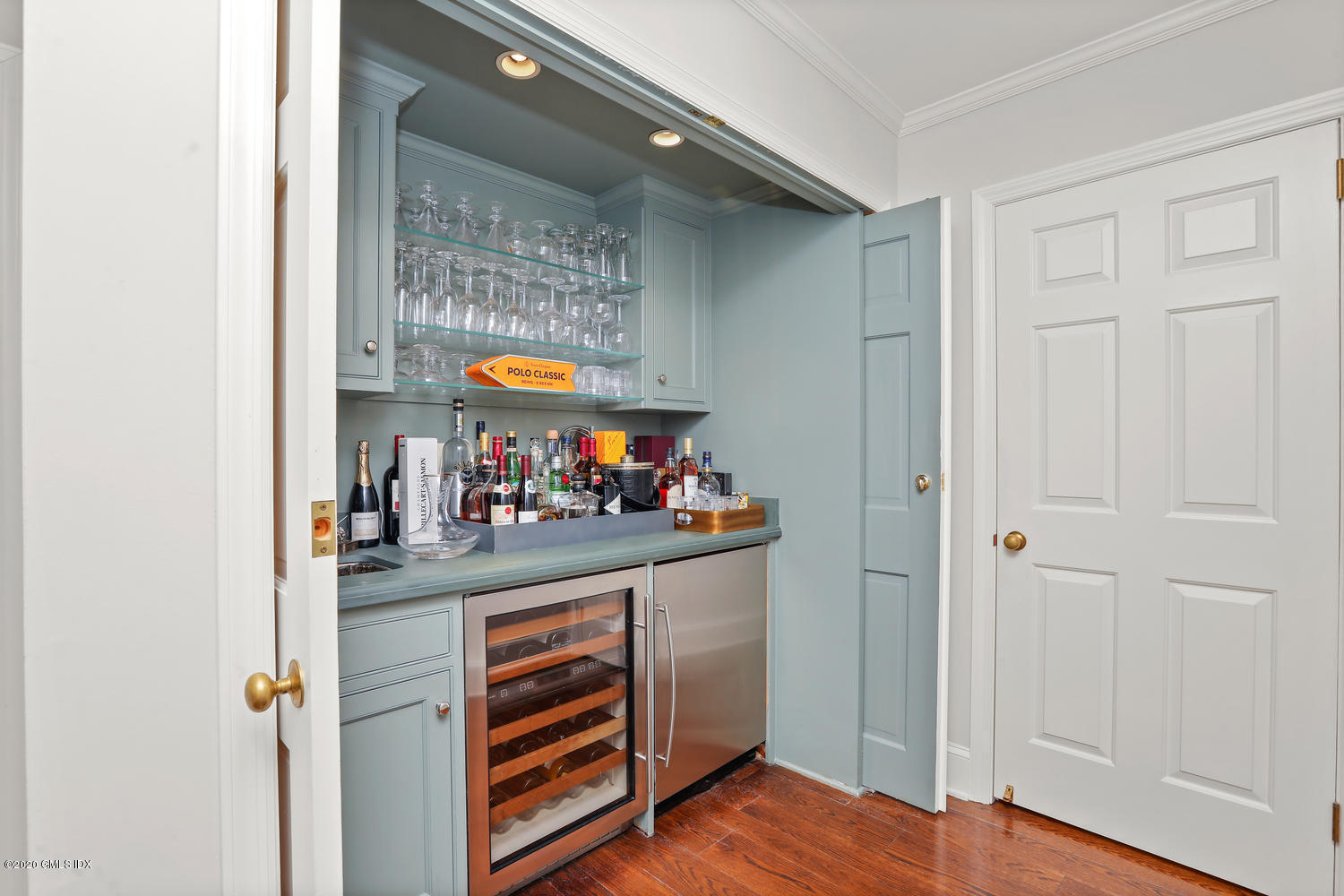 87 Perkins Road Greenwich, CT 06830 - Photo 16 of 45 a view of a hallway with entryway and wooden floor
