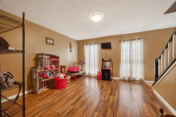 a bedroom with a bed and a flat screen television