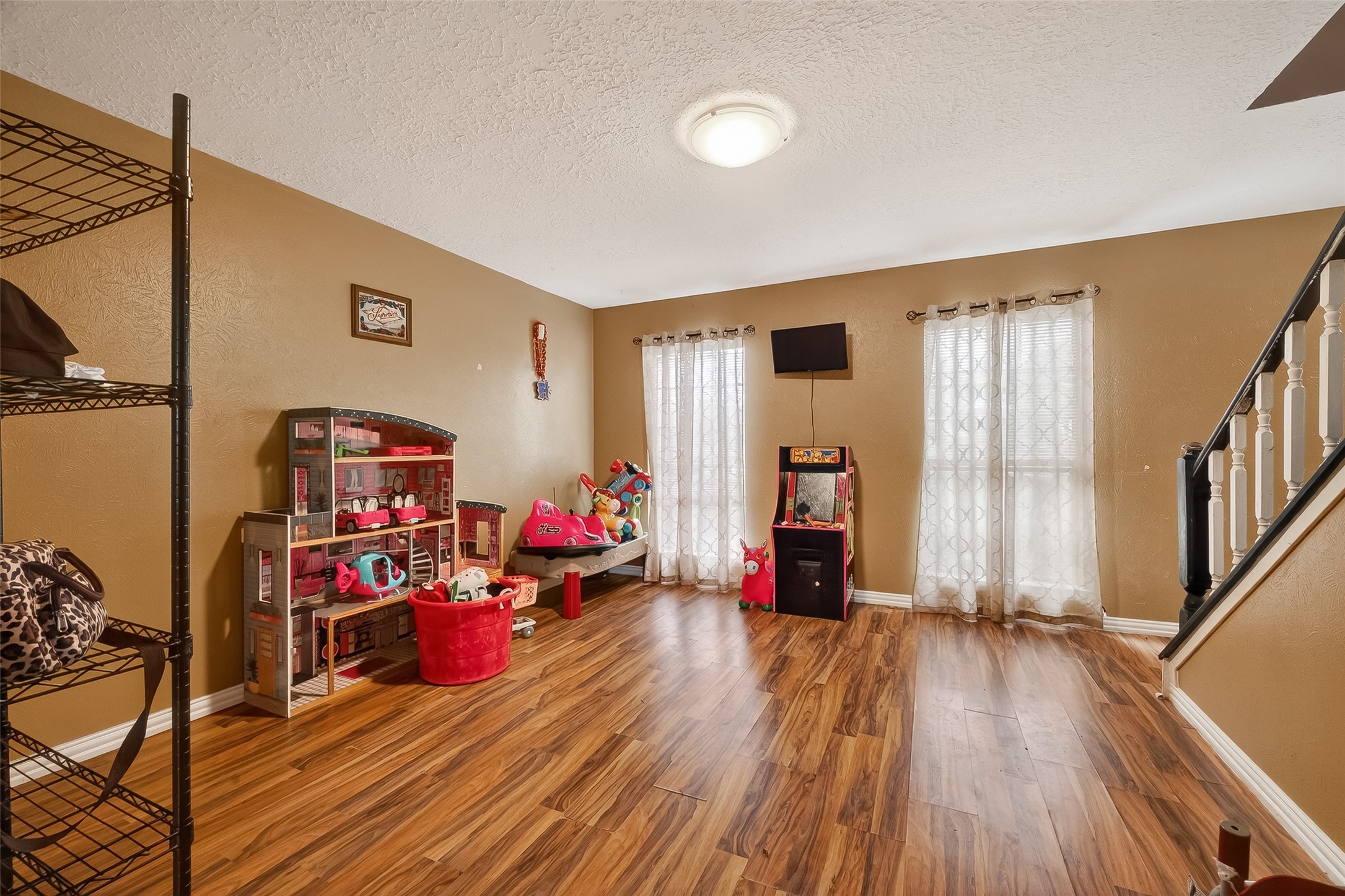 16006 El Toro Court Webster, TX 77598 - Photo 12 of 19 a view of a livingroom with workspace and a ceiling fan