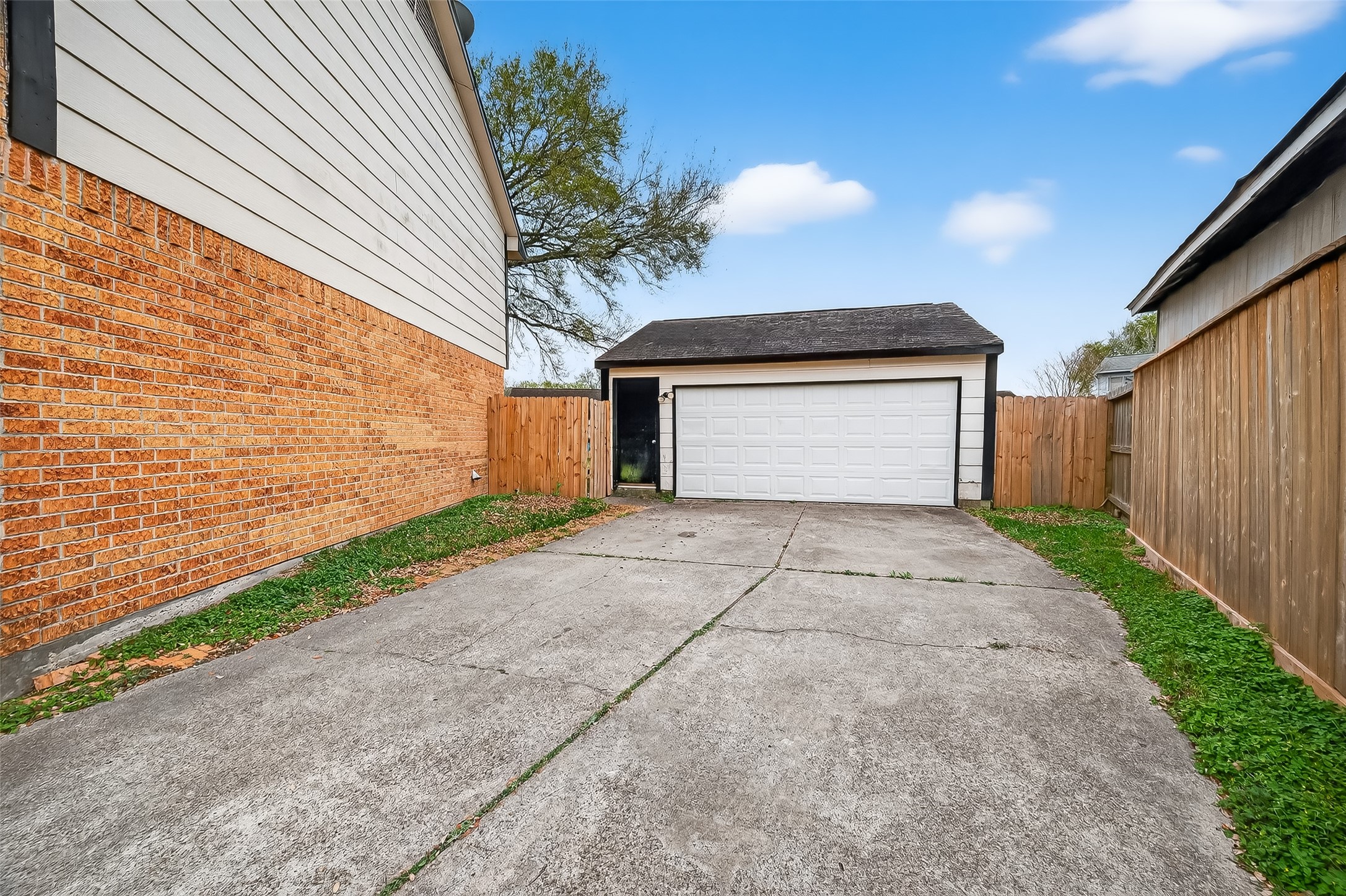 16006 El Toro Court Webster, TX 77598 - Photo 2 of 19 a front view of a house with a yard and garage