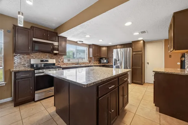 a bedroom with bed and wooden floor