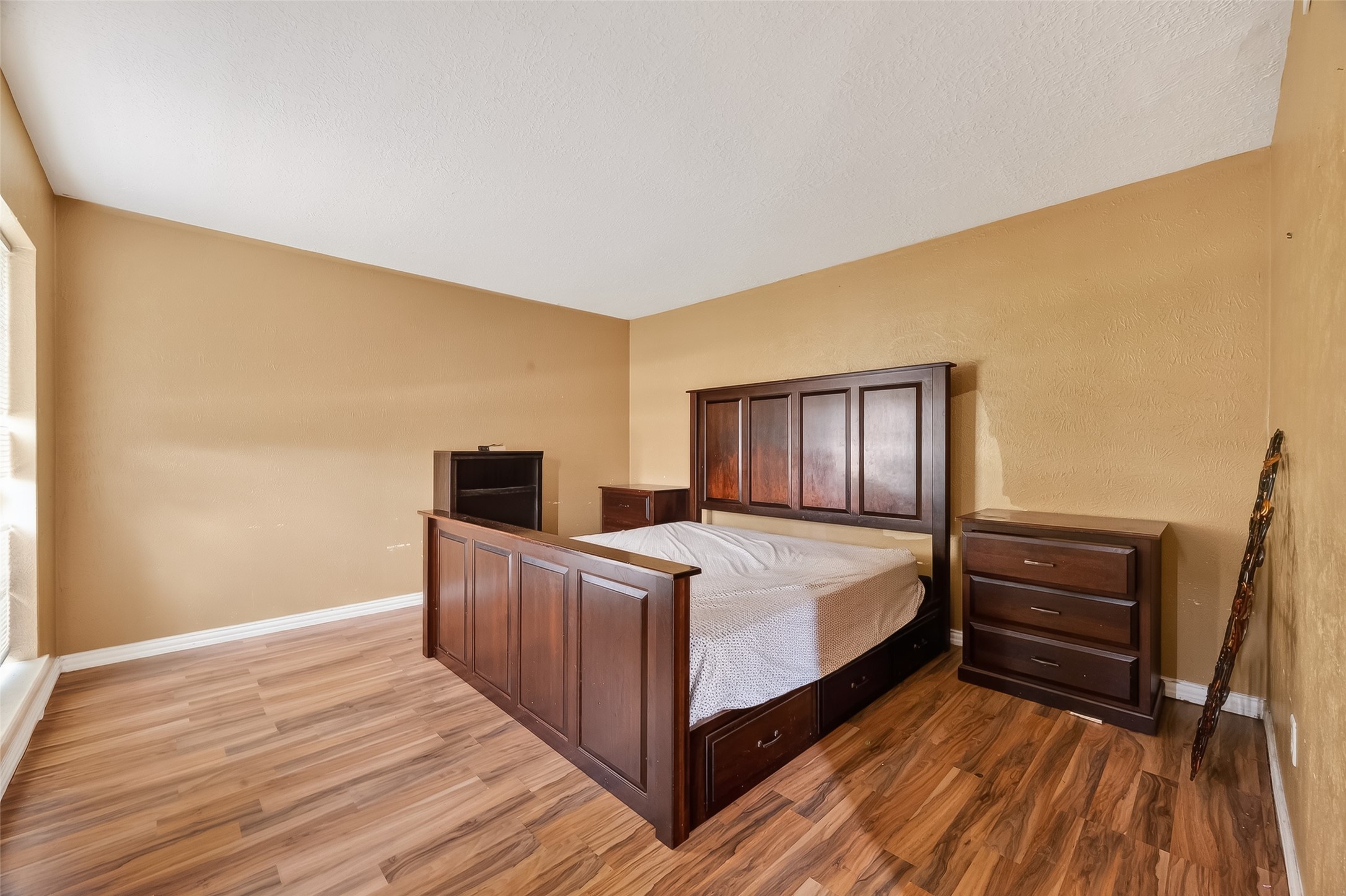 16006 El Toro Court Webster, TX 77598 - Photo 9 of 19 a bed room with a bed and dresser