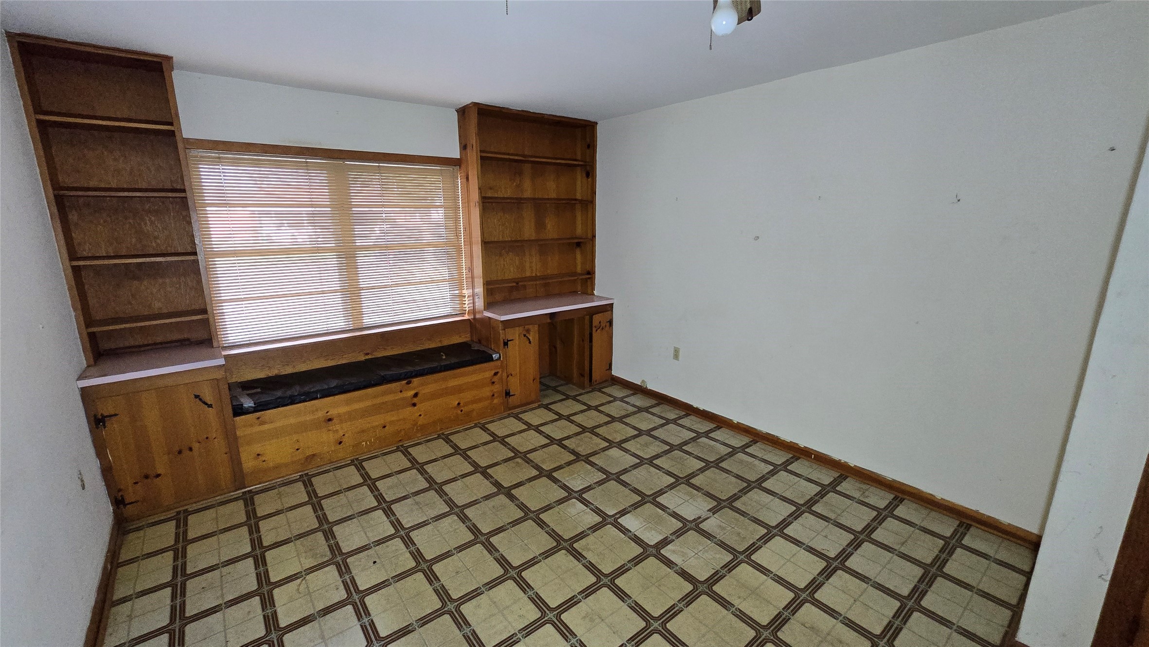 103 Long Drive Baytown, TX 77521 - Photo 13 of 21 a room with a wooden floor and a window