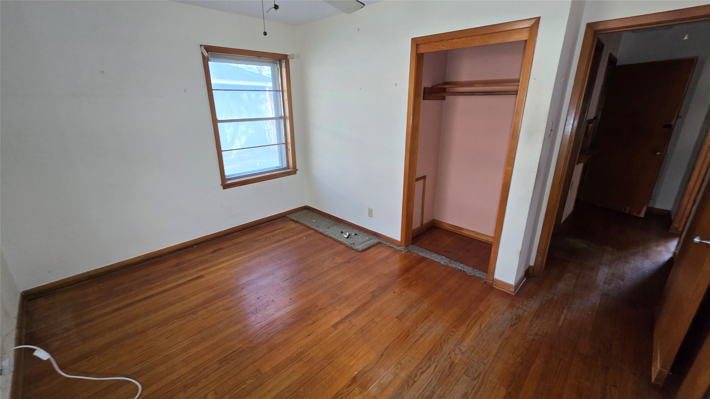 103 Long Drive Baytown, TX 77521 - Photo 17 of 21 an empty room with wooden floor and closet