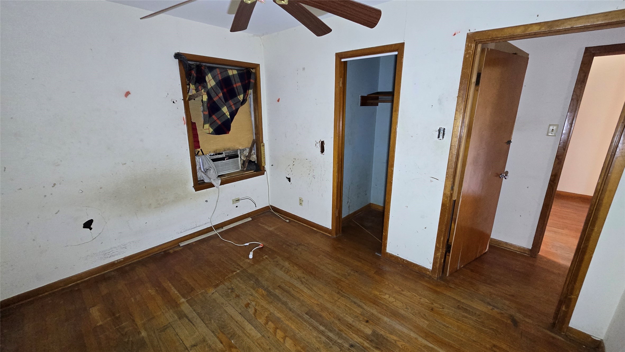 103 Long Drive Baytown, TX 77521 - Photo 21 of 21 an empty room with wooden floor and windows