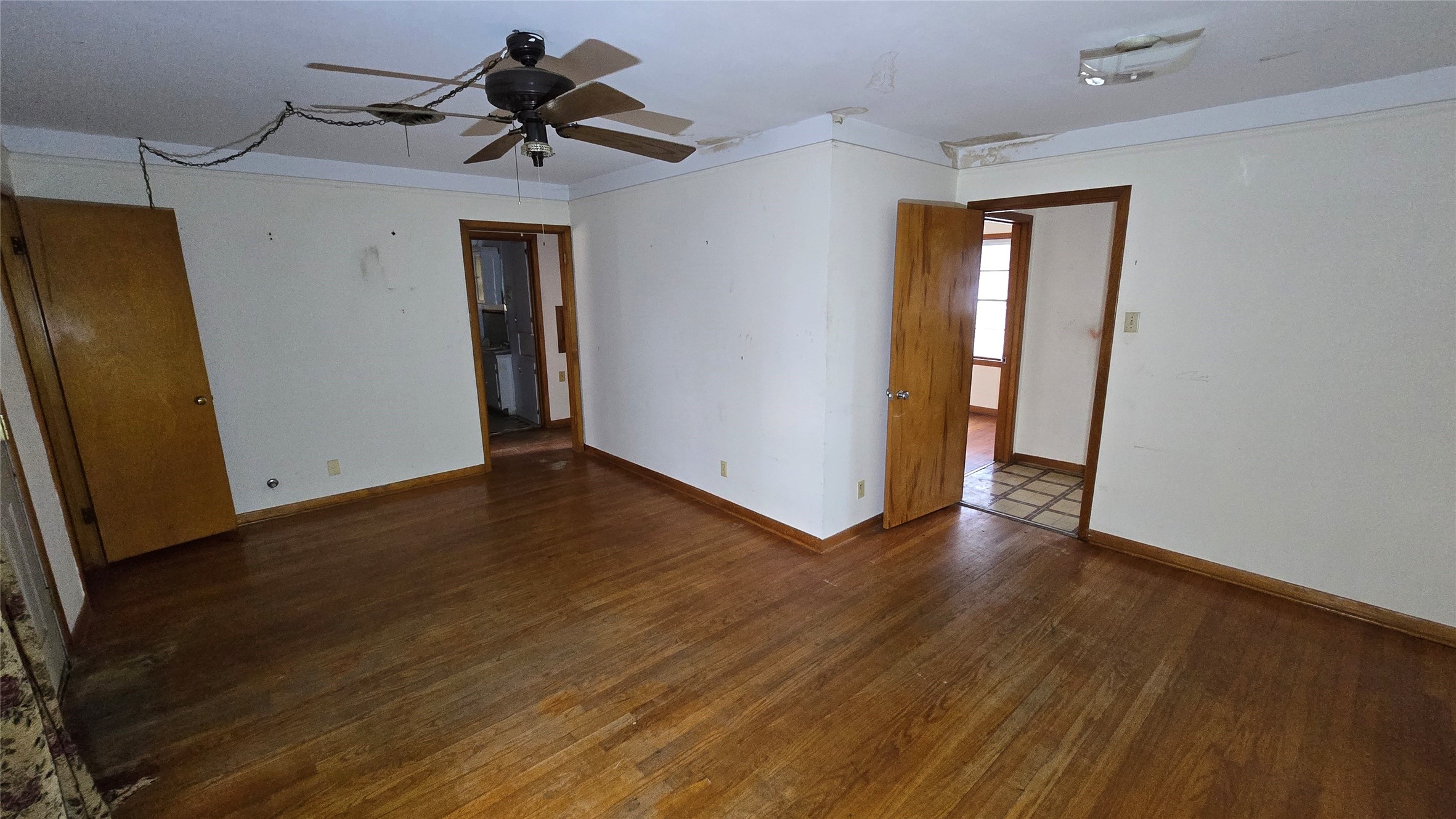 103 Long Drive Baytown, TX 77521 - Photo 6 of 21 a view of a hallway with wooden floor and a chandelier