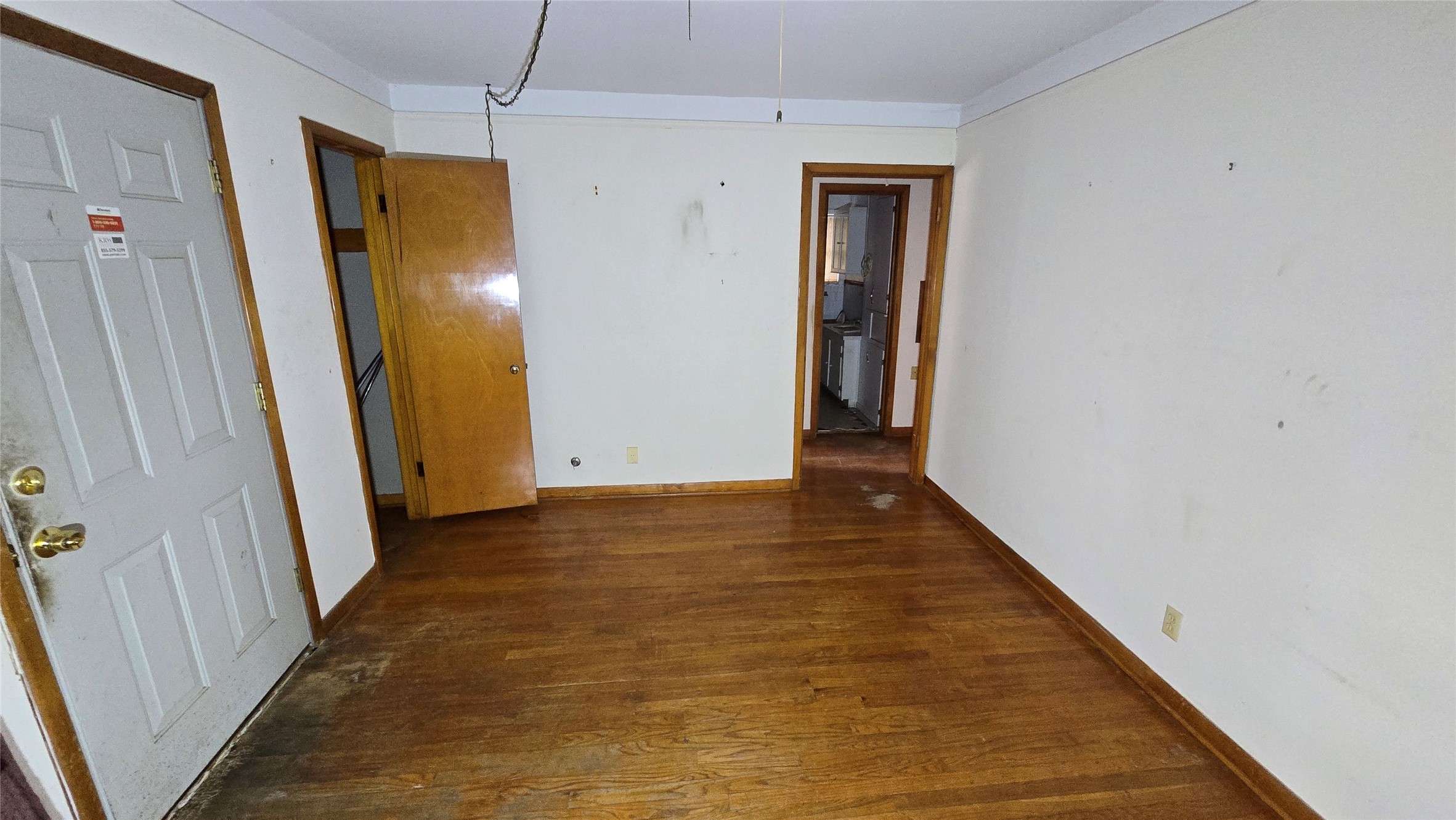 103 Long Drive Baytown, TX 77521 - Photo 7 of 21 a view of a hallway with wooden floor and a bathroom