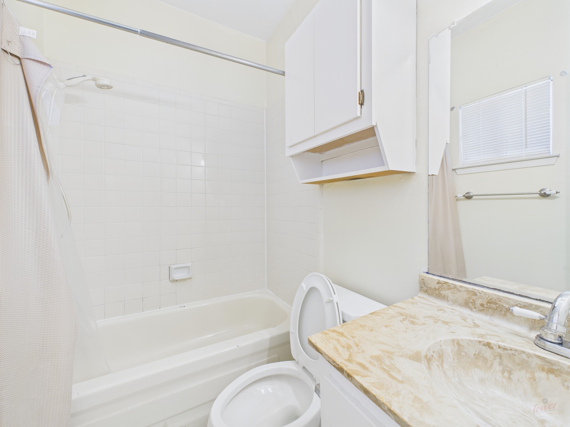 3316 Guadalupe Street, Unit 220 Austin, TX 78705 - Photo 11 of 14 a bathroom with a granite countertop sink toilet and shower