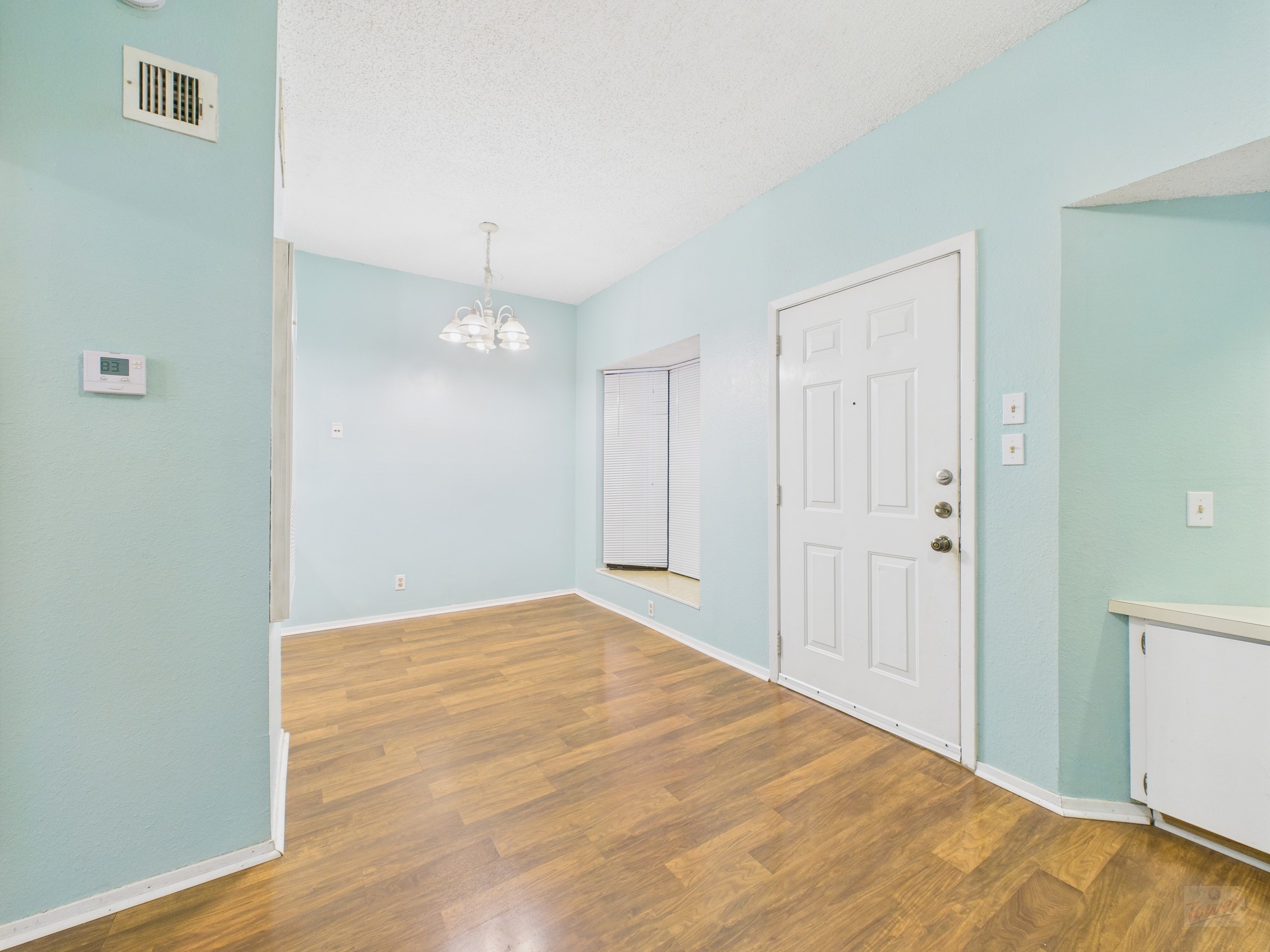 3316 Guadalupe Street, Unit 220 Austin, TX 78705 - Photo 4 of 14 a view of an empty room with wooden floor and closet