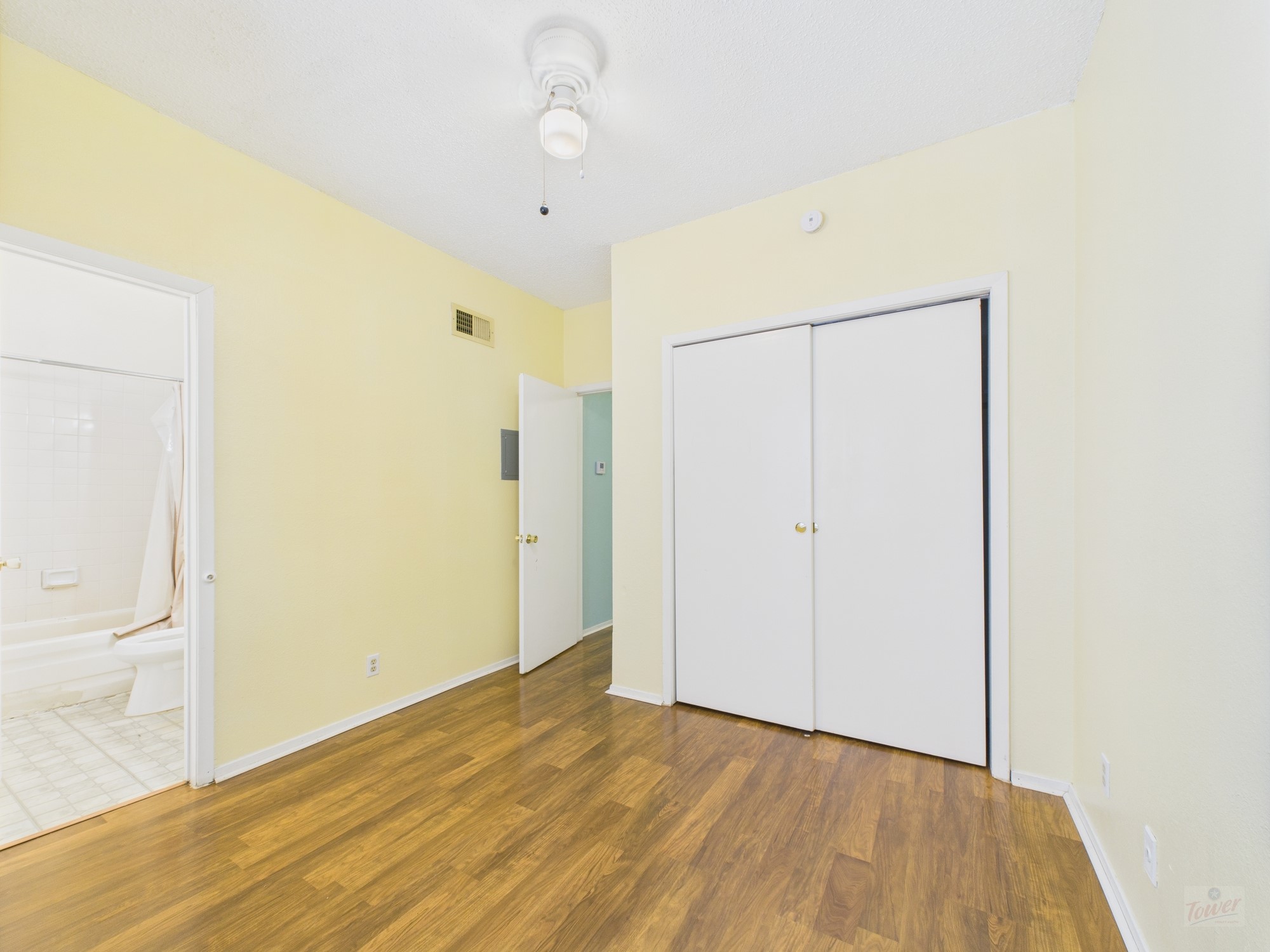 3316 Guadalupe Street, Unit 220 Austin, TX 78705 - Photo 10 of 14 a view of an empty room with wooden floor