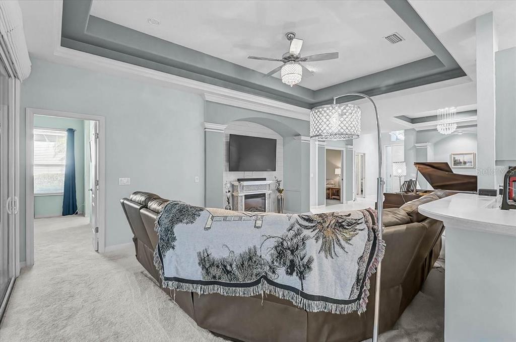 103 Bishopscourt Road Osprey, FL 34229 - Photo 9 of 55 a living room with furniture and a chandelier