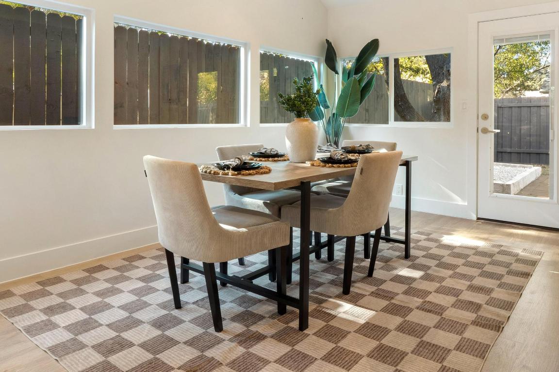 7010 Meadow Run Austin, TX 78745 - Photo 11 of 26 Dining area featuring baseboards and light wood finished floors