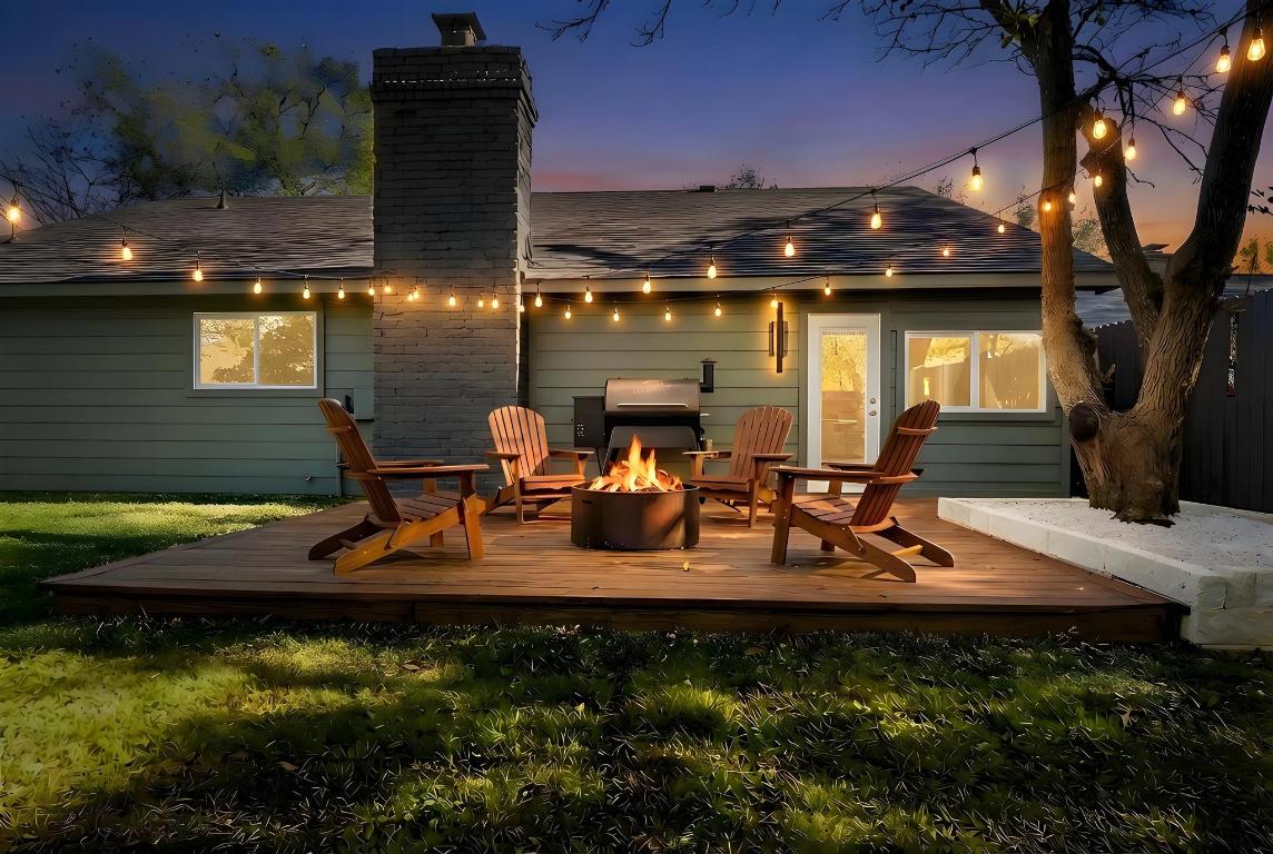 7010 Meadow Run Austin, TX 78745 - Photo 19 of 26 Back of house featuring a chimney, a wooden deck, and a fire pit