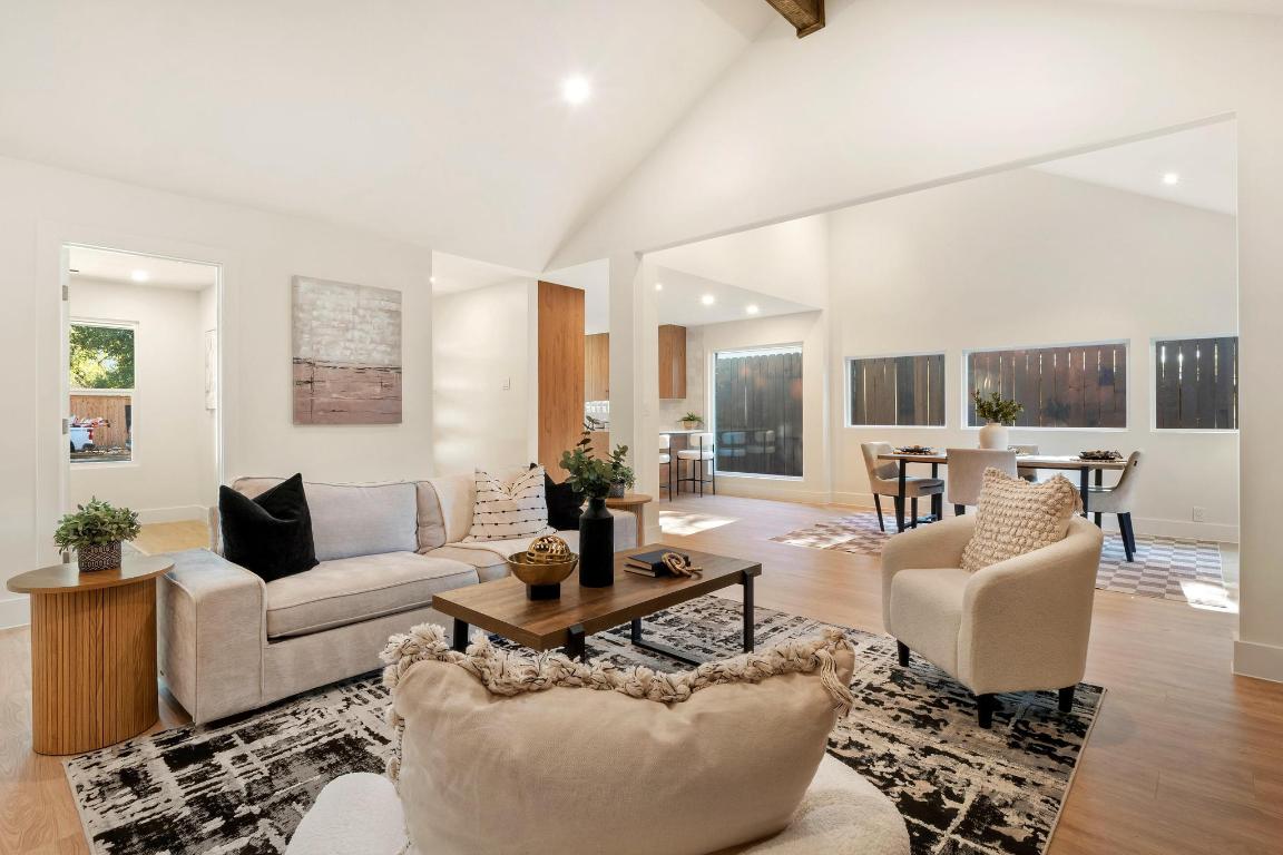 7010 Meadow Run Austin, TX 78745 - Photo 2 of 26 Living area with light wood-style flooring, recessed lighting, high vaulted ceiling, and beamed ceiling
