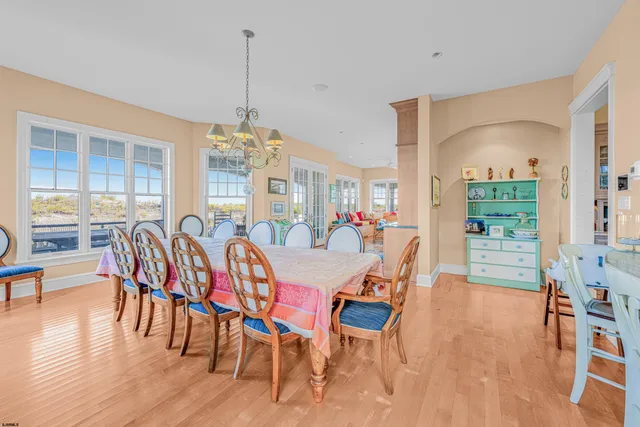 a kitchen with granite countertop a sink stainless steel appliances and white cabinets