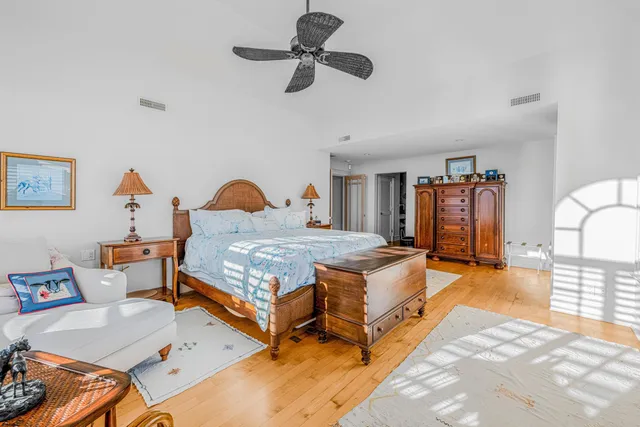 a white bath tub sitting in a bathroom next to a window