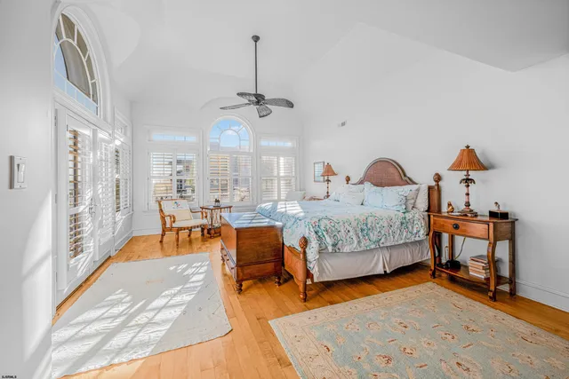 a spacious bedroom with a bed and a shower