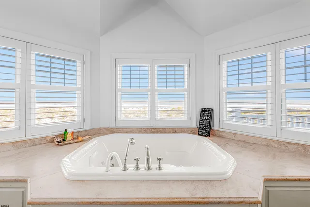 a view of a house with backyard and porch