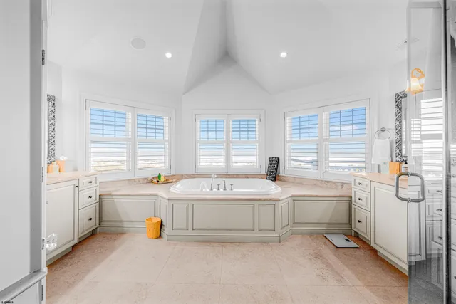 a view of a balcony with wooden chairs