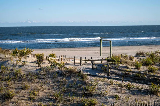a dining room with furniture and a window
