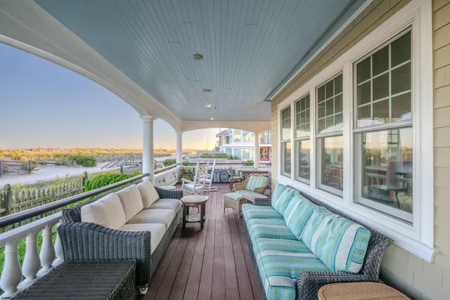 a view of a wooden deck with furniture