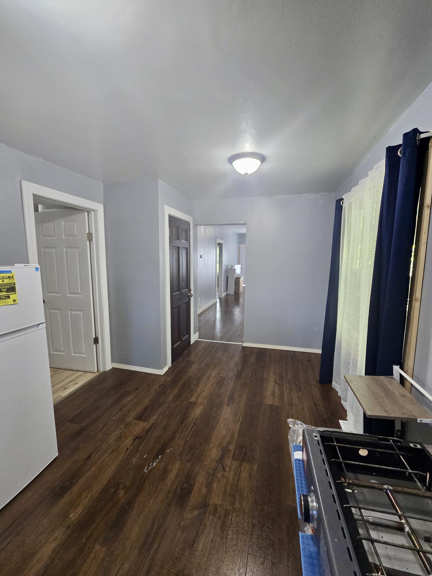 4613 Maryland Street Gary, IN 46409 - Photo 11 of 24 a view of a refrigerator in kitchen and wooden floor