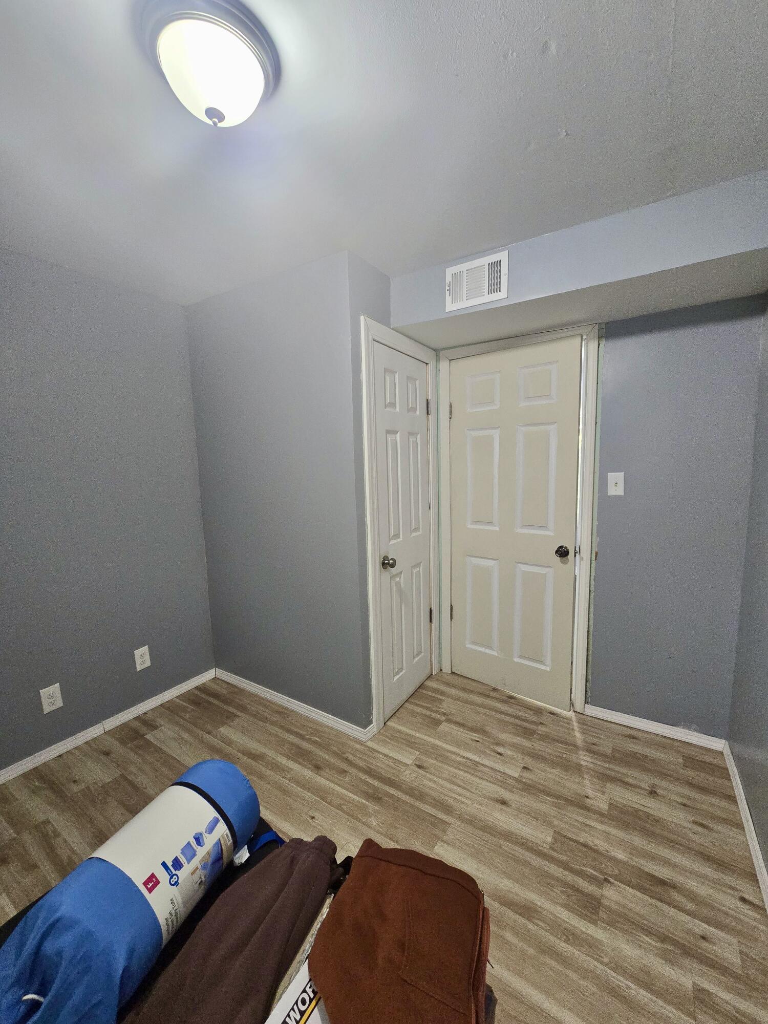 4613 Maryland Street Gary, IN 46409 - Photo 14 of 24 a bedroom with a bed and a lamp