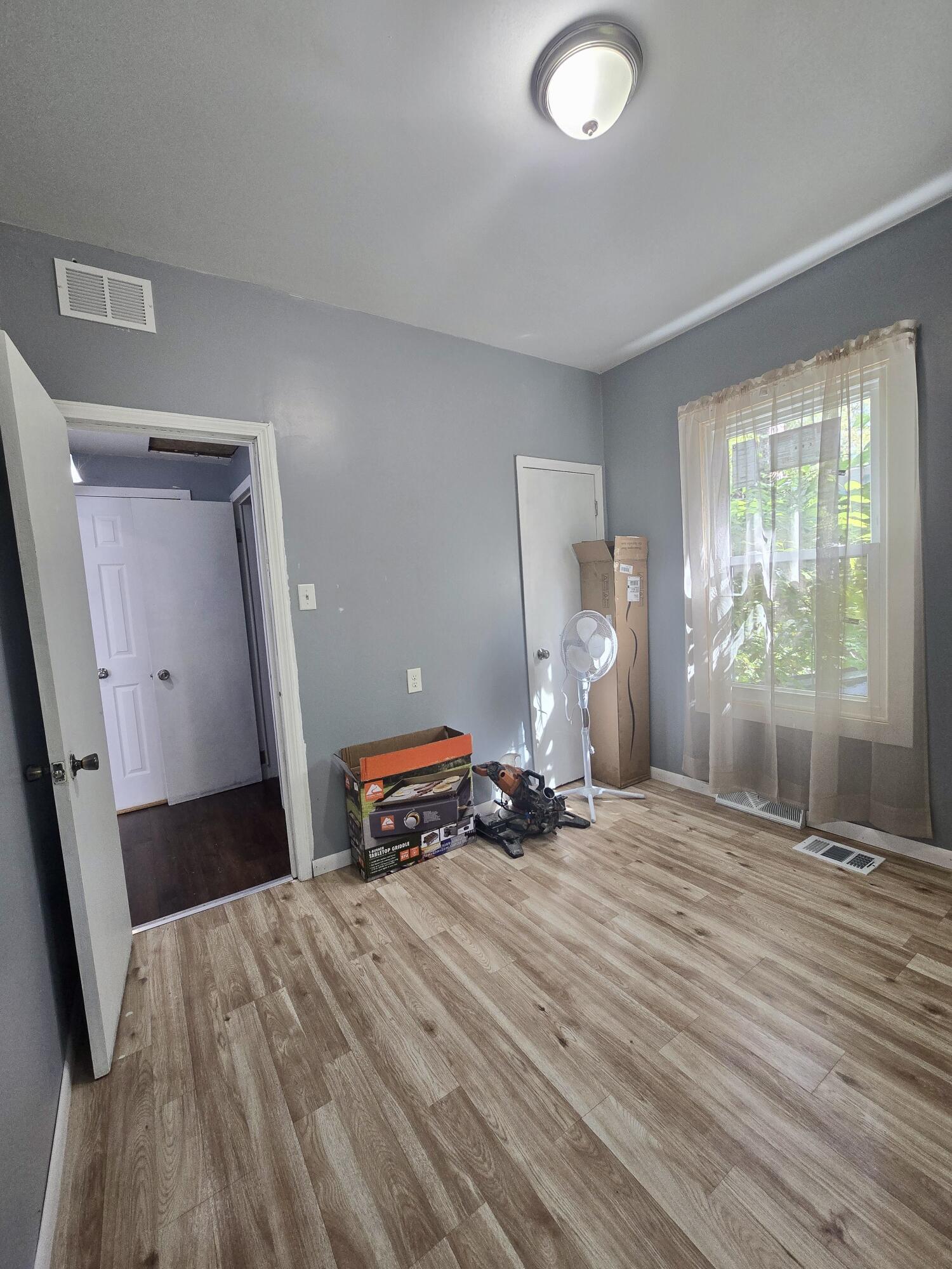 4613 Maryland Street Gary, IN 46409 - Photo 20 of 24 a bedroom with a bed and a window