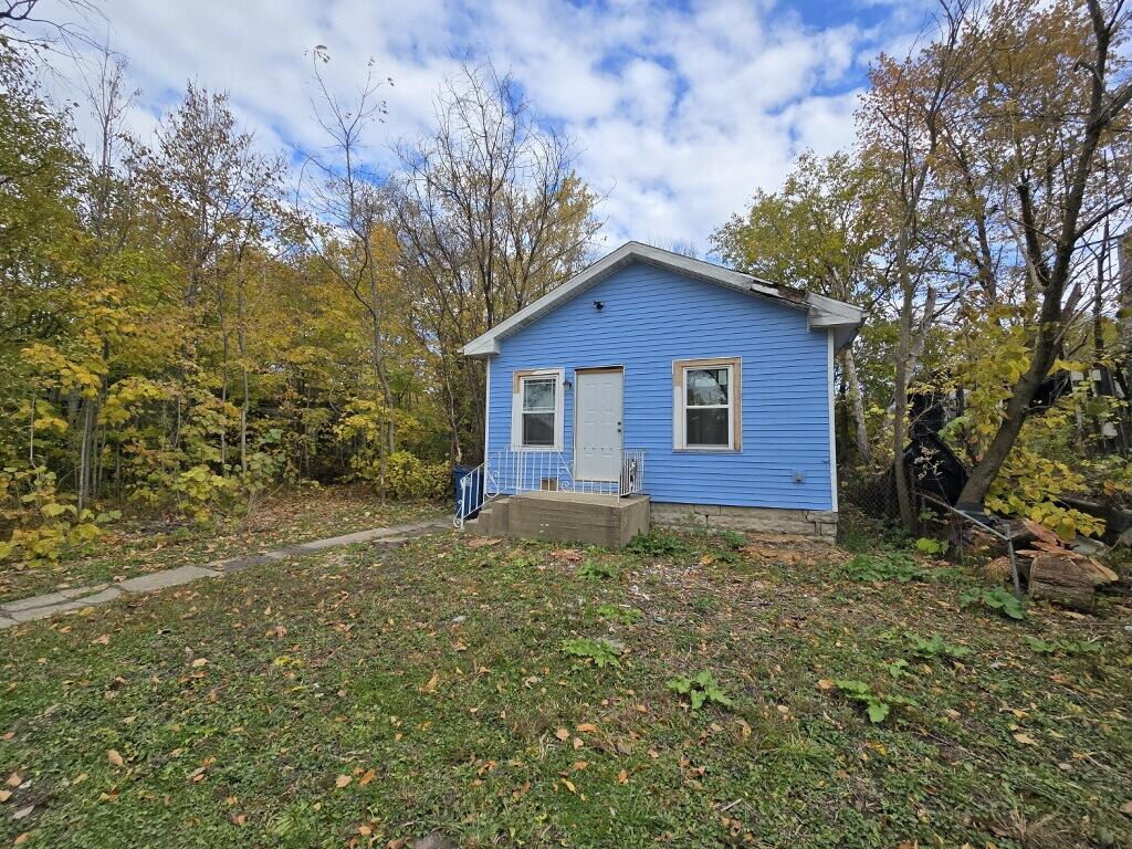 4613 Maryland Street Gary, IN 46409 - Photo 2 of 24 a view of a house with a yard