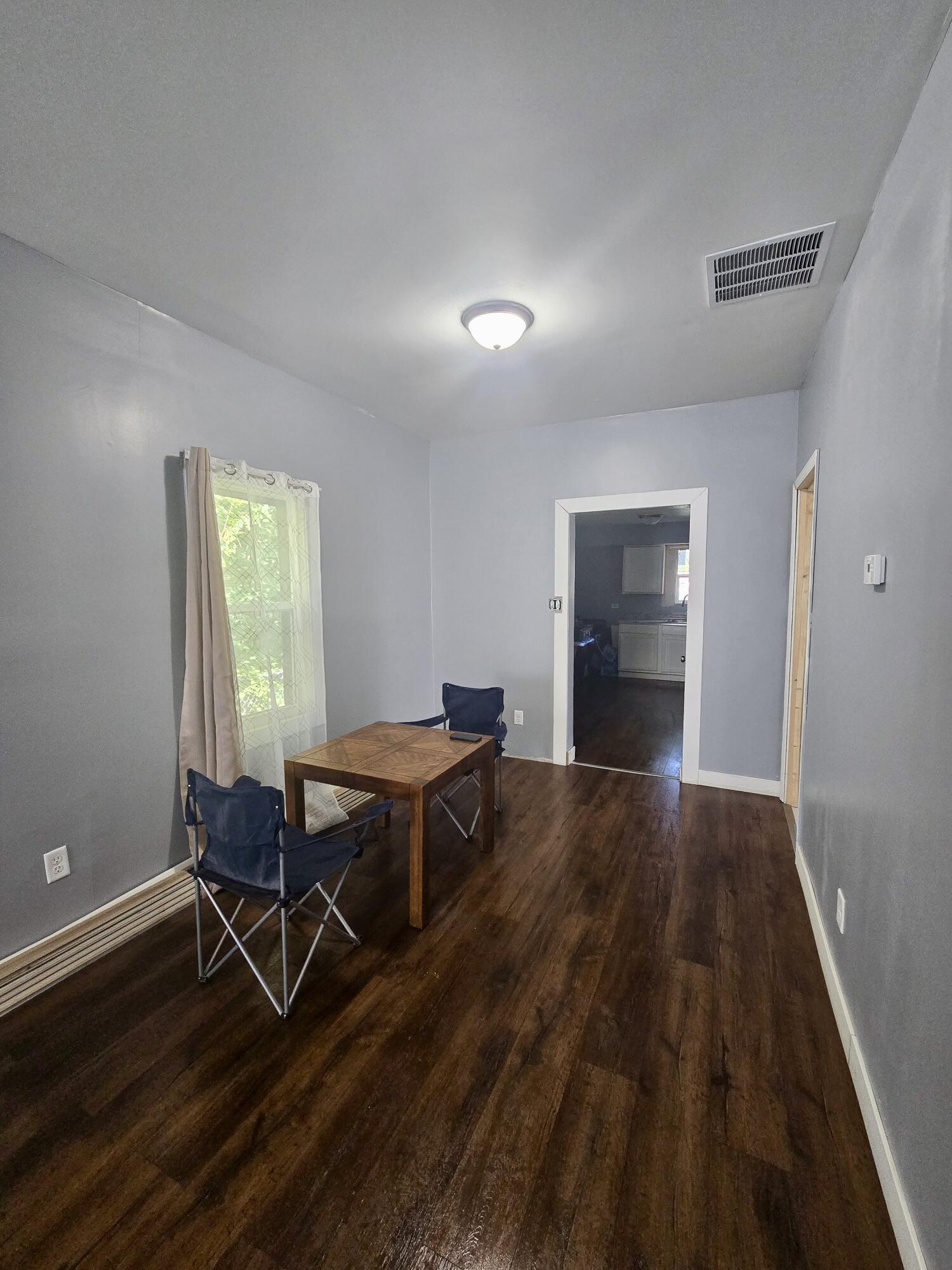 4613 Maryland Street Gary, IN 46409 - Photo 6 of 24 a room with wooden floor and furniture