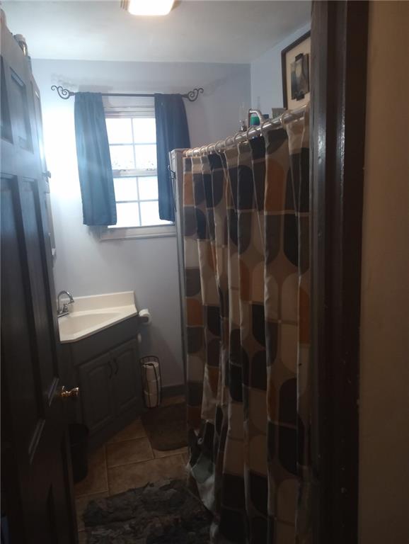 123 Highway 68 Rochester, PA 15074 - Photo 6 of 36 a bathroom with a shower a toilet and a sink