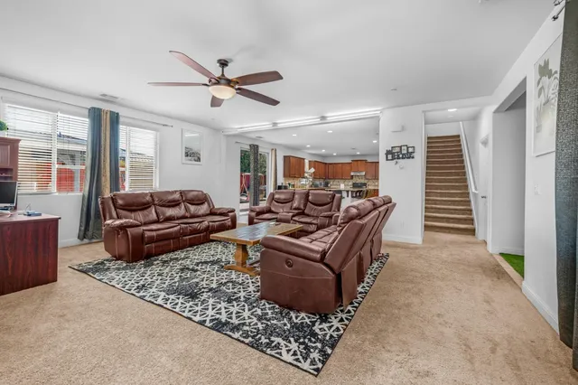 a view of kitchen with furniture and refrigerator