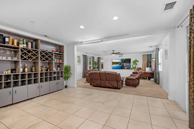 a bathroom with a sink a toilet a mirror and shower