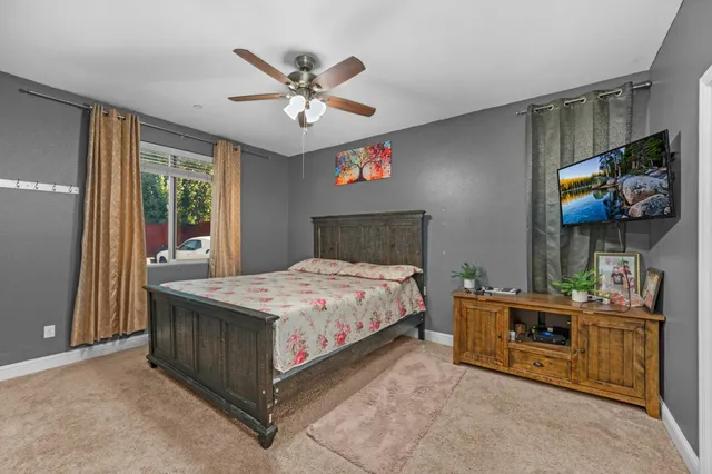 a bathroom with a sink toilet and mirror