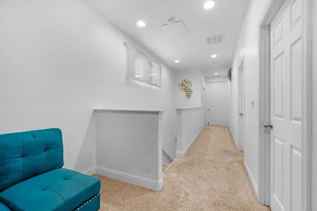 a bathroom with a double vanity sink a mirror and a shower