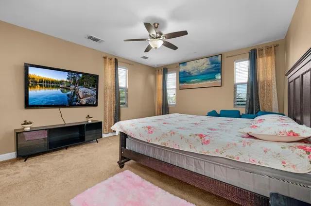 a backyard of a house with outdoor seating